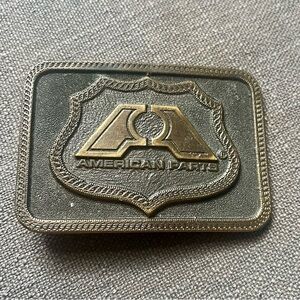 Vintage 1976 American Parts brass belt buckle.